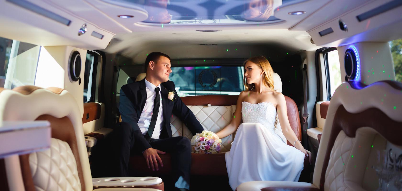 newly wed couple inside the limo