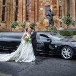 newly wed outside the Maserati Limo