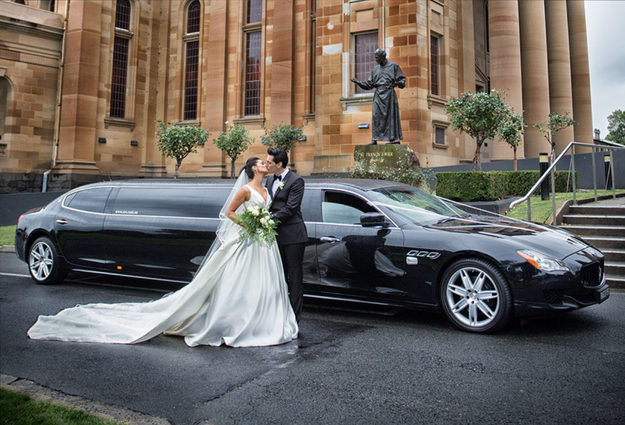 newly wed outside the Maserati Limo