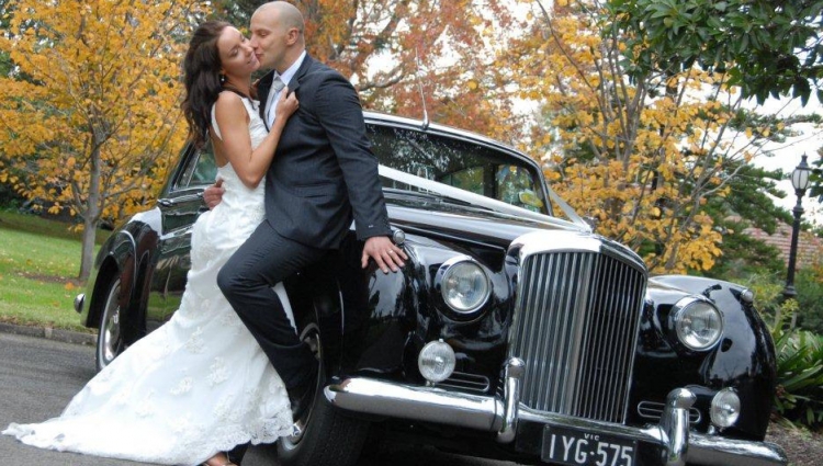 couple with the classic bentley